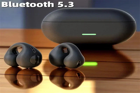 Wireless earbuds with charging case on a wooden surface, featuring Bluetooth 5.3 text.